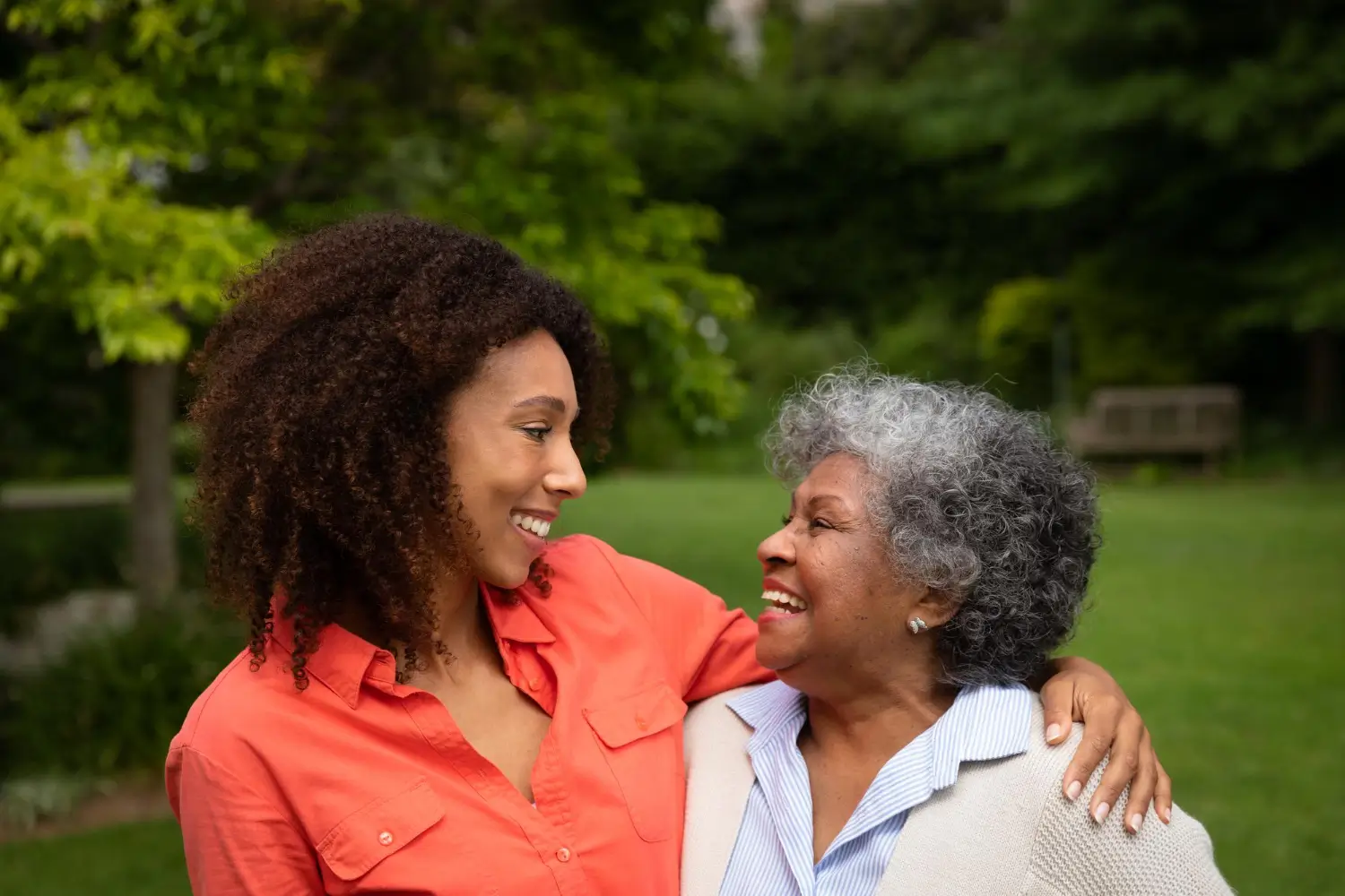 Personal concierge sharing a warm outdoor moment with an older woman through senior companionship services in Dover, Delaware.