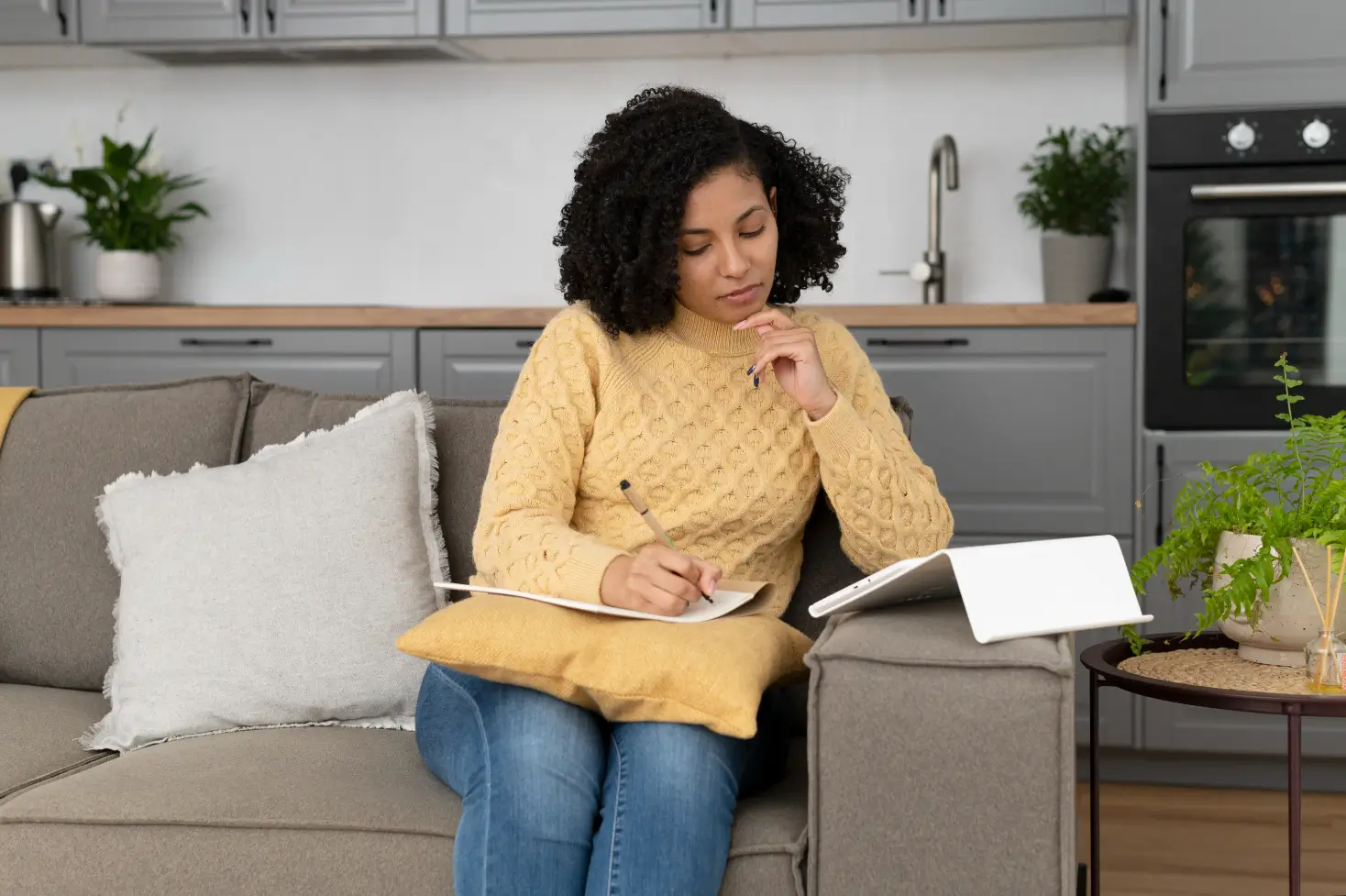 Woman organizing household tasks and planning daily responsibilities as part of home management support in Dover, Delaware.